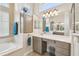 Bright bathroom with double vanity, countertop space, soaker tub and good lighting at 27223 Nostalgia Dr, Leesburg, FL 34748