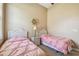 Comfortable bedroom featuring two twin beds and a window at 27223 Nostalgia Dr, Leesburg, FL 34748