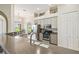 Kitchen with dual sinks, granite counters, stainless appliances, and light colored cabinets at 27223 Nostalgia Dr, Leesburg, FL 34748
