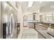 Kitchen featuring modern appliances, light cabinets, and easy access to breakfast and living areas at 27223 Nostalgia Dr, Leesburg, FL 34748