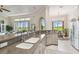 Kitchen featuring countertops, stainless steel appliances, and archway to dining area at 27223 Nostalgia Dr, Leesburg, FL 34748