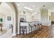 Kitchen with barstool seating at counter, skylight, and neutral color palette at 27223 Nostalgia Dr, Leesburg, FL 34748