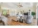 Open-concept living room with hardwood floors, neutral color palette, and elegant furnishings at 27223 Nostalgia Dr, Leesburg, FL 34748