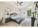 Spacious main bedroom features a king bed, neutral decor, and sliding doors to a lanai at 27223 Nostalgia Dr, Leesburg, FL 34748