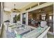 Enjoy the spacious screened lanai with multiple seating areas and access to the living room at 27223 Nostalgia Dr, Leesburg, FL 34748
