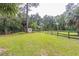 The fenced backyard features a shed and sprawling lawn at 3341 Se 45Th St, Ocala, FL 34480