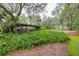 Lush backyard featuring a gazebo, mature trees, and green landscape at 3341 Se 45Th St, Ocala, FL 34480