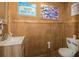 Quaint bathroom featuring unique wood paneling and fixtures at 3341 Se 45Th St, Ocala, FL 34480