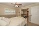 Bedroom featuring plantation shutters and neutral colors; second bedroom viewable through doorway at 3341 Se 45Th St, Ocala, FL 34480