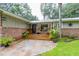 Charming home exterior with brick accents, a cozy front porch, and well-maintained landscaping at 3341 Se 45Th St, Ocala, FL 34480