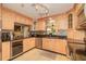 Well-lit kitchen featuring maple cabinets, granite countertops, and stainless steel appliances at 3341 Se 45Th St, Ocala, FL 34480