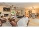 Open-concept living room with a fireplace, comfortable seating, and seamless access to dining area at 3341 Se 45Th St, Ocala, FL 34480