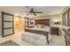 Large main bedroom featuring a king bed, neutral colors, and private bathroom at 3341 Se 45Th St, Ocala, FL 34480