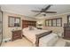Cozy main bedroom with a king bed, shutters, and ample storage at 3341 Se 45Th St, Ocala, FL 34480