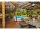 Spacious outdoor bar and entertainment area overlooking the pool at 3341 Se 45Th St, Ocala, FL 34480