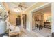 Bright sunroom featuring wood-look flooring, ceiling fan, and ample seating at 3341 Se 45Th St, Ocala, FL 34480
