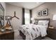 Charming bedroom featuring airplane themed decor, with a wood dresser and a plush bed at 1278 Whispering Ln, Minneola, FL 34715