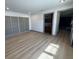 Bedroom with hardwood flooring and recessed lighting, offering access to a bathroom at 2963 Poplar Ave, Leesburg, FL 34748