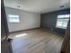 Bedroom with natural light, plank flooring, and neutral wall colors at 2963 Poplar Ave, Leesburg, FL 34748