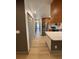 View of the home's interior with hardwood flooring and access to the modern kitchen at 2963 Poplar Ave, Leesburg, FL 34748