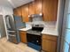 Well-appointed kitchen with stainless steel appliances, sleek countertops, and ample cabinetry at 2963 Poplar Ave, Leesburg, FL 34748