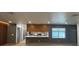 An open-concept living space featuring modern design, wood floors, and large windows at 2963 Poplar Ave, Leesburg, FL 34748