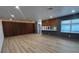 An open living space featuring modern design, wood floors, and large windows at 2963 Poplar Ave, Leesburg, FL 34748