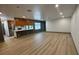 Spacious living room with an open floor plan, wood floors, and ample natural light at 2963 Poplar Ave, Leesburg, FL 34748