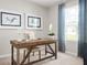 Bright home office featuring a rustic desk, comfortable seating, and an abundance of natural light at 1203 Turtle Island Rd, Lady Lake, FL 32159