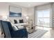 Cozy living room with comfortable seating, stylish decor, and sliding door access to the outdoors at 1203 Turtle Island Rd, Lady Lake, FL 32159