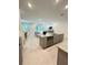 Bright living room featuring an open floor plan, kitchen island, and sliding glass doors at 5236 Luisa Ct, St Cloud, FL 34771