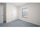 Neutral bedroom offers natural light through a window and a closet at 8471 Clearway Dr, Wildwood, FL 34785