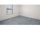 Bedroom featuring plush carpeting and a window providing natural light at 8471 Clearway Dr, Wildwood, FL 34785