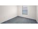 Bedroom with neutral paint and cozy gray carpeting at 8471 Clearway Dr, Wildwood, FL 34785