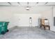 Spacious garage with concrete floor, storage, and access door at 8471 Clearway Dr, Wildwood, FL 34785