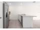 Bright kitchen featuring stainless steel appliances and an island with a sink and breakfast bar at 8471 Clearway Dr, Wildwood, FL 34785