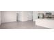 Open concept living and kitchen area features modern finishes and lots of natural light at 8471 Clearway Dr, Wildwood, FL 34785
