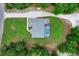 An aerial view of house with a screened-in pool and well-kept garden at 9783 Sw 206Th Court Rd, Dunnellon, FL 34431