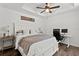 Bedroom with ceiling fan and small office with two monitors set up at 9783 Sw 206Th Court Rd, Dunnellon, FL 34431