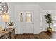 Bright foyer with hardwood floors, decorative lighting, and a charming entry table adding warmth to the space at 9783 Sw 206Th Court Rd, Dunnellon, FL 34431