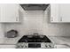 Modern kitchen with granite countertops, stainless steel appliances, and tile backsplash at 9783 Sw 206Th Court Rd, Dunnellon, FL 34431