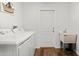 The laundry room contains a side-by-side washer and dryer, utility sink, and storage at 9783 Sw 206Th Court Rd, Dunnellon, FL 34431