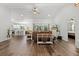 Open floorplan featuring kitchen, dining, and living spaces, hardwood floors, and natural light at 9783 Sw 206Th Court Rd, Dunnellon, FL 34431