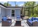 Enclosed patio with a fire pit and seating area, perfect for outdoor entertaining at 9783 Sw 206Th Court Rd, Dunnellon, FL 34431