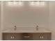 Bathroom vanity with dual sinks, modern fixtures, and stylish under-cabinet storage at 10859 William And Mary Ct, Orlando, FL 32821