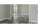 Bedroom with modern flooring, closet with sliding doors, and natural light from the outdoor patio at 10859 William And Mary Ct, Orlando, FL 32821