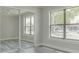 Bedroom featuring sliding mirror closet doors, window, and light ceiling fan at 10859 William And Mary Ct, Orlando, FL 32821