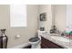 Cozy bathroom with decorative vases, a granite countertop, and a modern toilet at 1382 Heritage Landings Dr, Lakeland, FL 33805