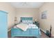 Calm bedroom with blue-painted furniture, neutral walls, carpet flooring, and coordinated bedding at 1382 Heritage Landings Dr, Lakeland, FL 33805