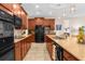 Spacious kitchen with stainless steel appliances, brown cabinets, light countertops and tile floor and backsplash at 1382 Heritage Landings Dr, Lakeland, FL 33805